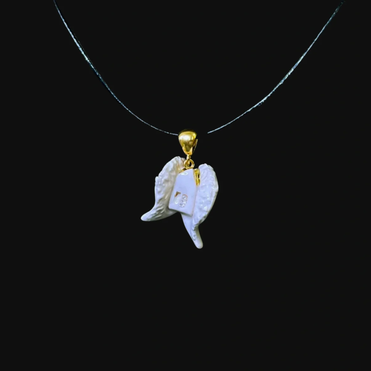 A witness to the sacrament of baptism: the medallion "A house wrapped in angel's wings"