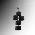 Sidabrinis-kryželis-su-juodu-porcelianu Silver cross pendant with black porcelain cubes strung on a silver structure